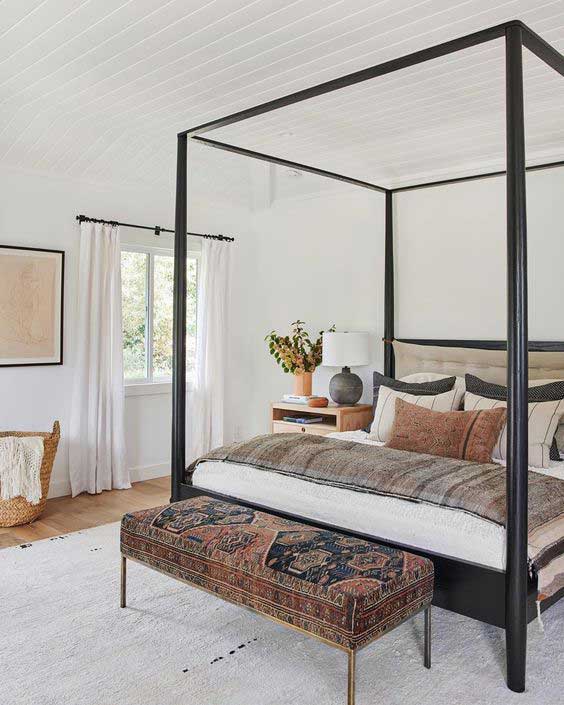 an open room with a canopy bed taking center stage