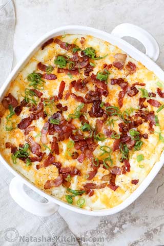 potatoe casserole with bacon, cheese and green onion sprinkled on top