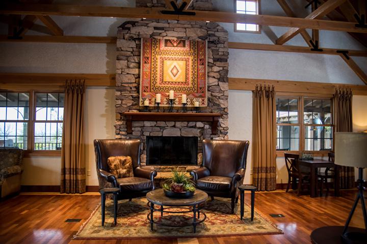 Whitney Ranch The Ranch House interior cozy fireplace with armchairs